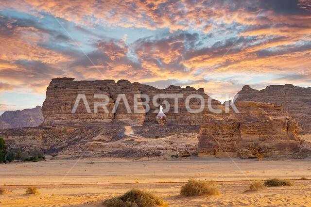 Drive on the beautiful scenic road between Riyadh and AlUla, through a landscape of sand desert, rock formations and mountains, in Saudi Arabia