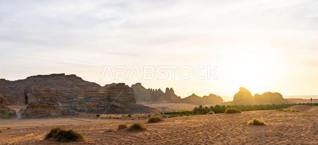 Drive on the beautiful scenic road between Riyadh and AlUla, through a landscape of sand desert, rock formations and mountains, in Saudi Arabia