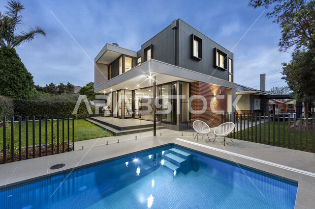 A picture of a modern house with a swimming pool, modern and attractive designs, modern villa design, architectural art