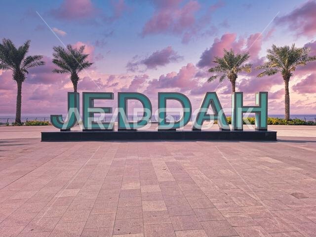 The Corniche of Jeddah sparkles with the iconic Jeddah sign, a vibrant landmark welcoming all to the scenic waterfront and the Red Sea, in Saudi Arabi The Corniche of Jeddah sparkles with the iconic Jeddah sign, a vibrant landmark welcoming all to the scenic waterfront and the Red Sea, in Saudi Arabi