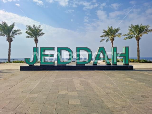 The Corniche of Jeddah sparkles with the iconic Jeddah sign, a vibrant landmark welcoming all to the scenic waterfront and the Red Sea, in Saudi Arabi The Corniche of Jeddah sparkles with the iconic Jeddah sign, a vibrant landmark welcoming all to the scenic waterfront and the Red Sea, in Saudi Arabi