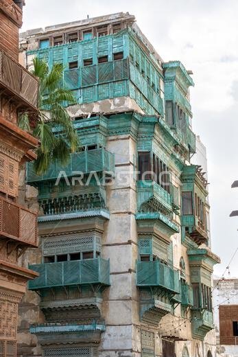 Architectural gems of Al Balad, historic heart of Jeddah, Saudi Arabia, stand serene and weathered, preserving rich cultural heritage of the city Architectural gems of Al Balad, historic heart of Jeddah, Saudi Arabia, stand serene and weathered, preserving rich cultural heritage of the city