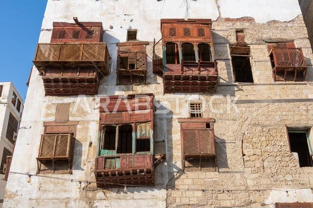 Architectural gems of Al Balad, historic heart of Jeddah, Saudi Arabia, stand serene and weathered, preserving  rich cultural heritage of the city
