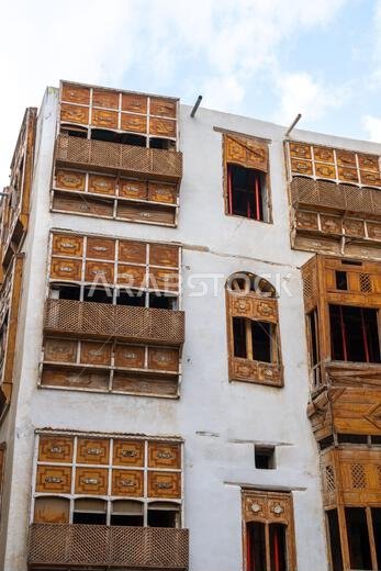 Architectural gems of Al Balad, historic heart of Jeddah, Saudi Arabia, stand serene and weathered, preserving  rich cultural heritage of the city