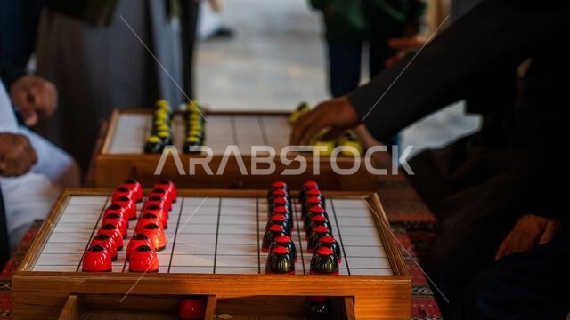 Doha, Qatar-January 18, 2025: A close-up shot of the traditional Arabic board game, Al Damam, played in Qatar, reflecting the country's rich cultural Doha, Qatar-January 18, 2025: A close-up shot of the traditional Arabic board game, Al Damam, played in Qatar, reflecting the country's rich cultural