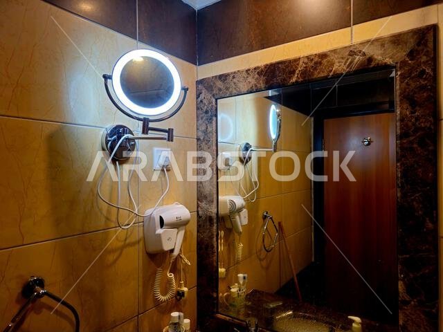 Mecca, Saudi Arabia, June 23 2024: Shaving, makeup concave round mirror wall mounted with led light, an essential accessory in the bathroom for men an