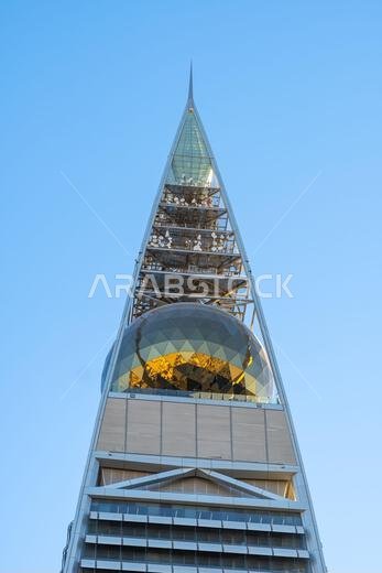 Riyadh, Saudi Arabia - December 22, 2024: Al Faisaliah Tower in Riyadh, Saudi Arabia, with its distinctive skyscraper design and gleaming facade, symb