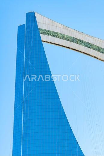Riyadh, Saudi Arabia - December 22, 2024: The Kingdom Centre in Riyadh, Saudi Arabia, with its distinctive skyscraper design and gleaming facade, symb