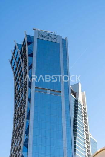 Riyadh, Saudi Arabia - December 22, 2024: Walking at sunset in Olaya Street among the modern skyscrapers of downtown Riyadh, Saudi Arabia