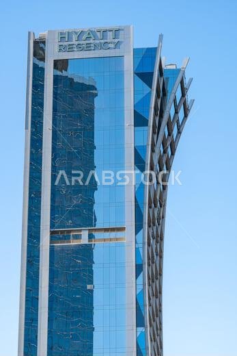 Riyadh, Saudi Arabia - December 22, 2024: Walking at sunset in Olaya Street among the modern skyscrapers of downtown Riyadh, Saudi Arabia