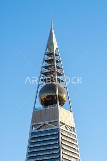 Riyadh, Saudi Arabia - December 22, 2024: Al Faisaliah Tower in Riyadh, Saudi Arabia, with its distinctive skyscraper design and gleaming facade, symb