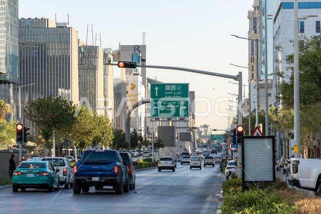 Riyadh, Saudi Arabia - December 22, 2024: Walking at sunset in Olaya Street among the modern skyscrapers of downtown Riyadh, Saudi Arabia