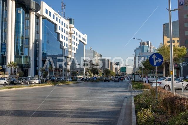 Riyadh, Saudi Arabia - December 22, 2024: Walking at sunset in Olaya Street among the modern skyscrapers of downtown Riyadh, Saudi Arabia