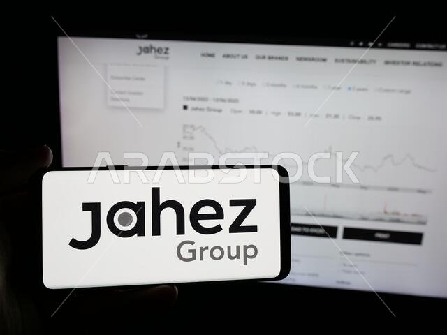 Stuttgart, Germany - 06-13-2025: Person holding smartphone with logo of Saudi Arabian technology company Jahez Group on screen in front of website.