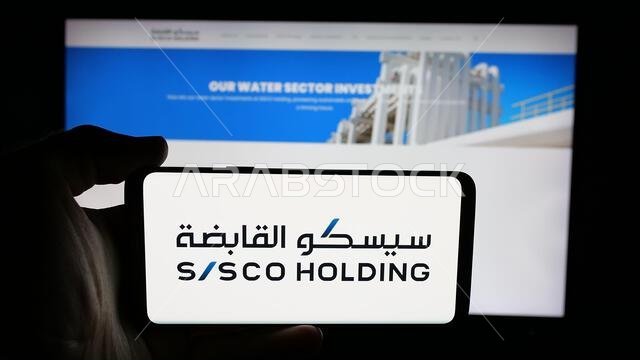 Stuttgart, Germany - 06-14-2025: Person holding cellphone with logo of Sustained Infrastructure Holding Co. (SISCO) on screen in front of webpage.