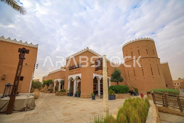 Saudi Arabian traditional Najdi architecture in Diriyah, Riyadh, features mud-brick buildings with decorative white trim, blending historical