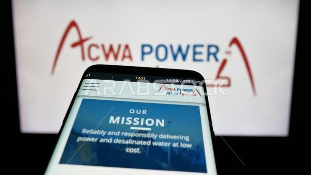 Stuttgart, Germany - 06-12-2025: Mobile phone with website of Saudi energy generation company ACWA Power on screen in front of logo.