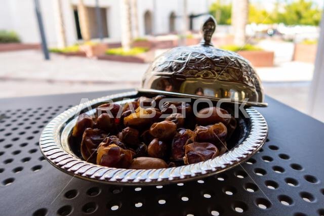 Omani dried dates on a silver tray.