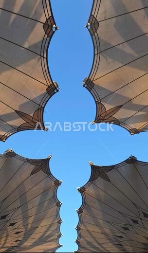 Medina, Saudi Arabia - March 7, 2024: Exterior architecture of giant umbrella at the Masjid an-Nabawi