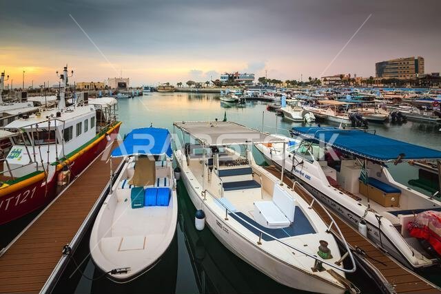 Golden Hour Harbor: Capturing the Tranquil Beauty of Sunrise in Fanateer Beach's Boats Yard, Al Jubail City,Saudi Arabia Golden Hour Harbor: Capturing the Tranquil Beauty of Sunrise in Fanateer Beach's Boats Yard, Al Jubail City,Saudi Arabia