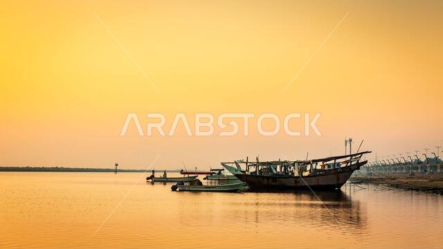 Golden Hour Majesty: Sunrise Silhouettes of Boats on Dammam Corniche, Saudi Arabia Golden Hour Majesty: Sunrise Silhouettes of Boats on Dammam Corniche, Saudi Arabia