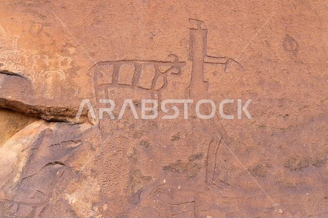 Middle East, Saudi Arabia, Hail Province, Jubbah. Ancient petroglyph of a man and an animal at the Jubbah rock art site at Ob Sinman Mountain.