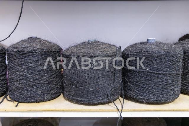 Middle East, Saudi Arabia, Tabuk. Spools of heavy wool trhead at a tent maker's shop.