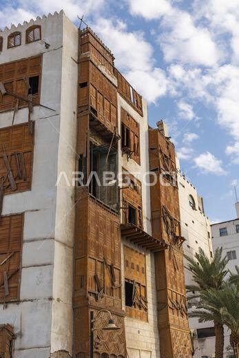 Middle East, Saudi Arabia, Mecca, Jeddah, Al-Balad. Traditional Hijazi tower house with wooden Rosan windows and balconies.