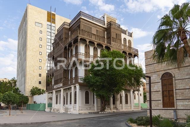 Middle East, Saudi Arabia, Mecca, Jeddah, Al-Balad. Traditional Hijazi tower house with wooden Rosan windows and balconies. Middle East, Saudi Arabia, Mecca, Jeddah, Al-Balad. Traditional Hijazi tower house with wooden Rosan windows and balconies.