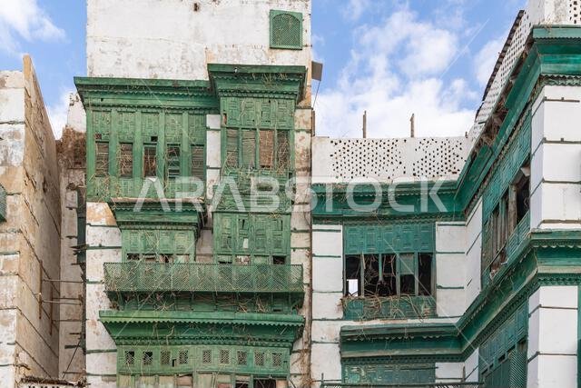 Middle East, Saudi Arabia, Mecca, Jeddah, Al-Balad. Traditional Hijazi tower house with wooden Rosan windows and balconies.