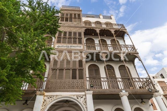 Middle East, Saudi Arabia, Mecca, Jeddah, Al-Balad. Traditional Hijazi tower house with wooden Rosan windows and balconies.