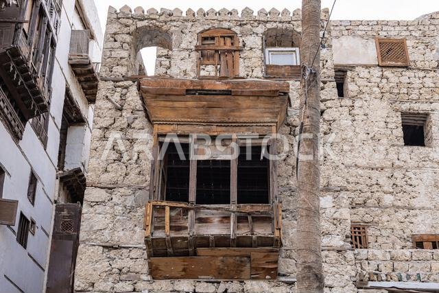 Middle East, Saudi Arabia, Mecca, Jeddah, Al-Balad. Traditional Hijazi tower house with wooden Rosan windows and balconies.