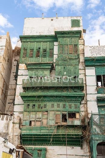 Middle East, Saudi Arabia, Mecca, Jeddah, Al-Balad. Traditional Hijazi tower house with wooden Rosan windows and balconies.