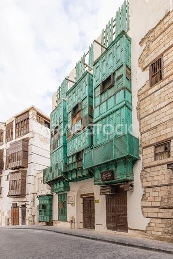 Middle East, Saudi Arabia, Mecca, Jeddah, Al-Balad. Traditional Hijazi tower house with wooden Rosan windows and balconies.
