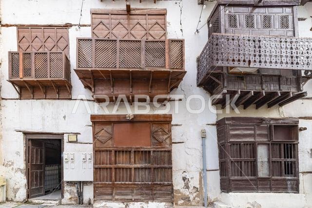 Middle East, Saudi Arabia, Mecca, Jeddah, Al-Balad. Traditional Hijazi tower house with wooden Rosan windows and balconies.