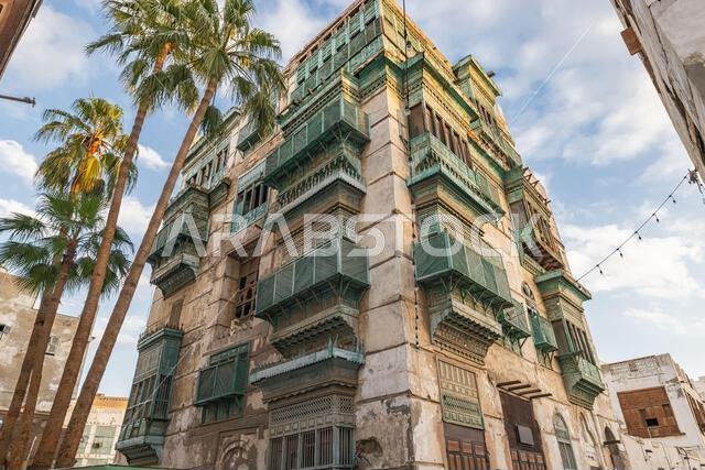 Middle East, Saudi Arabia, Mecca, Jeddah, Al-Balad. Traditional Hijazi tower house with wooden Rosan windows and balconies.