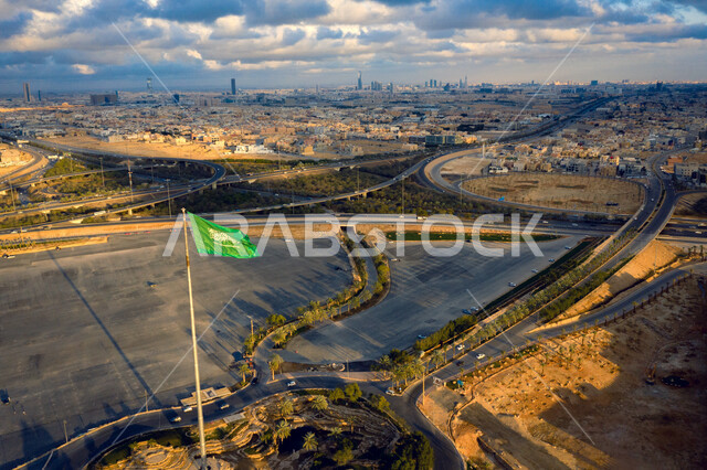 A view from the top of the largest flagpole in the Diriyah region in the city of Riyadh in the Kingdom of Saudi Arabia, an aerial photograph of the flagpole in the city of Riyadh during the day, a picture of the flagpole of King Salman Square in Diriyah, 