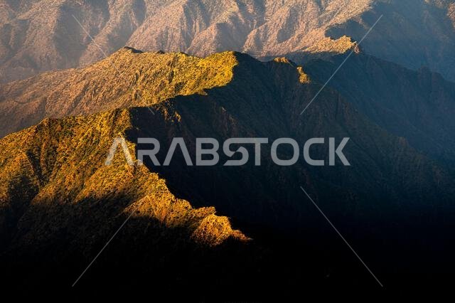 Dramatic and picturesque mountain landscape. Sunrise from Jabal Mareer. The Sarawat Mountains, Saudi Arabia.