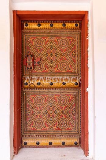 Middle East, Saudi Arabia, Al-Qassim, Unaizah. November 13, 2023. Colorfully painted door in Unaizah. November 13, 2023.