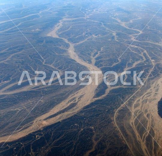 A Surreal aerial view of dried river beds in the desert in Jordan near the border with Saudi Arabia.