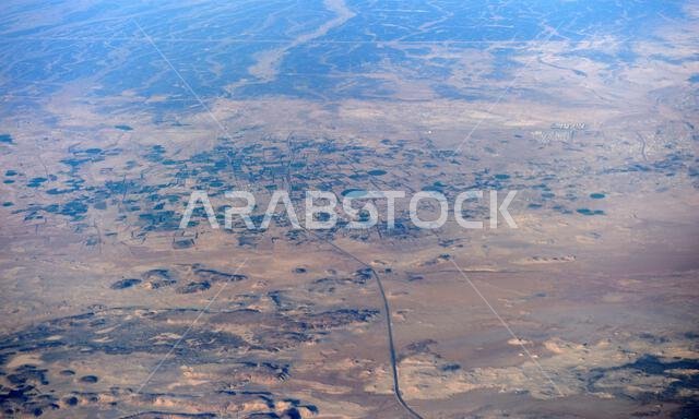Aerial view of circular agriculture fields in the Arabian desert in Saudi Arabia. Aerial view of circular agriculture fields in the Arabian desert in Saudi Arabia.