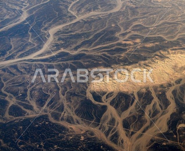 A Surreal aerial view of dried river beds in the desert in Jordan near the border with Saudi Arabia.