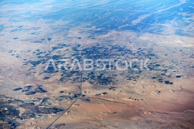 Aerial view of circular agriculture fields in the Arabian desert in Saudi Arabia.