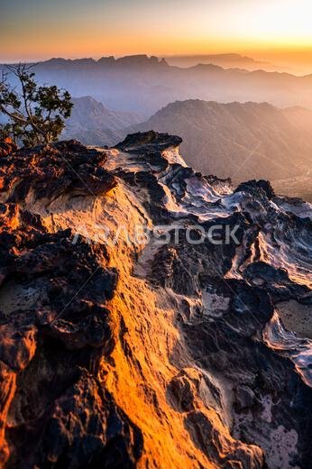 Colorful landscape background at sunrise in the Asir Mountains in Saudi Arabia.