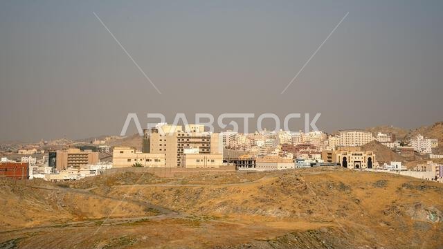 Typical Arabian architecture at suburbs of Mecca, Saudi Arabia, overcast - dust and sand - sky above