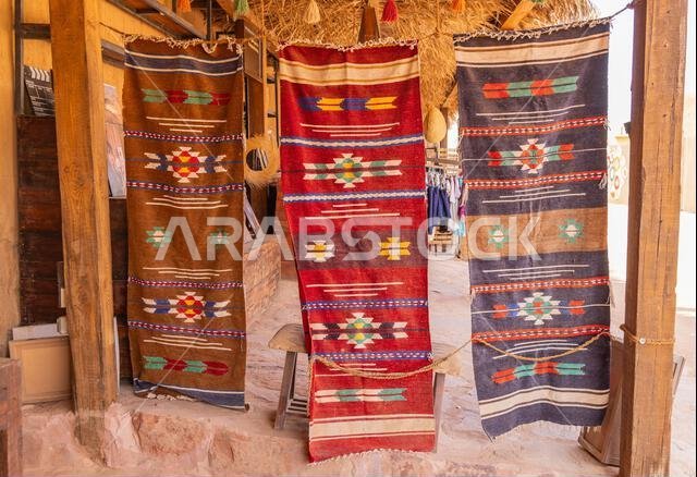 Middle East, Saudi Arabia, Medina, Al-Ula. November 18, 2023. Traditional blacnkets and rugs at a shop in old town Al-Ula. November 18, 2023.