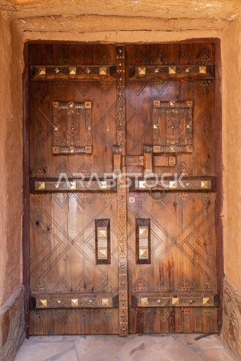 Ushaiger Heritage Village, Riyadh, Saudi Arabia, Middle East. Decorative old wooden door in the Ushaiger Heritage Village.
