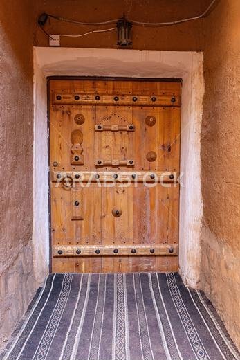 Ushaiger Heritage Village, Riyadh, Saudi Arabia, Middle East. Decorative old wooden door in the Ushaiger Heritage Village. Ushaiger Heritage Village, Riyadh, Saudi Arabia, Middle East. Decorative old wooden door in the Ushaiger Heritage Village.