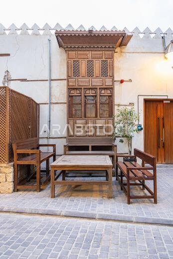Middle East, Saudi Arabia, Mecca Province, Jeddah. November 21, 2023. Outdoor seating on a street in the Al-Balad historical district.
