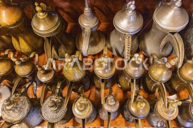 Ushaiger Heritage Village, Riyadh, Saudi Arabia, Middle East. Traditional brass and tin coffee pots in the Ushaiger Heritage Village.